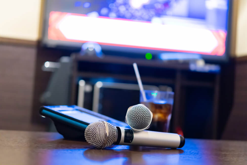 Microphone and remote control in karaoke box.