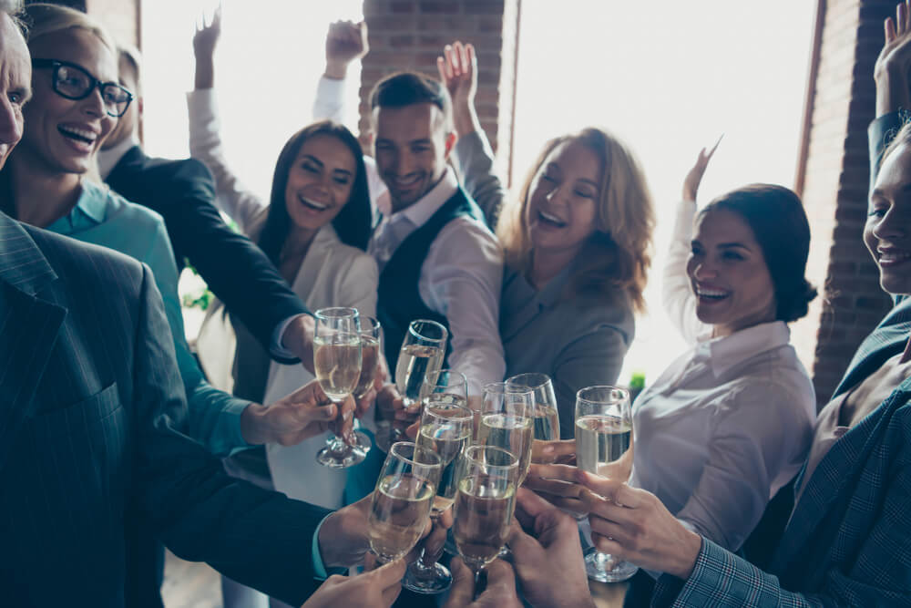 Close up photo of large big company of people having fun in office.