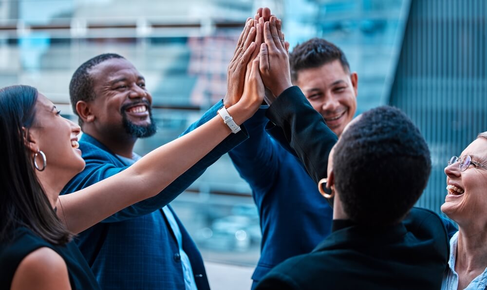 A group of corporate people celebrating company growth.