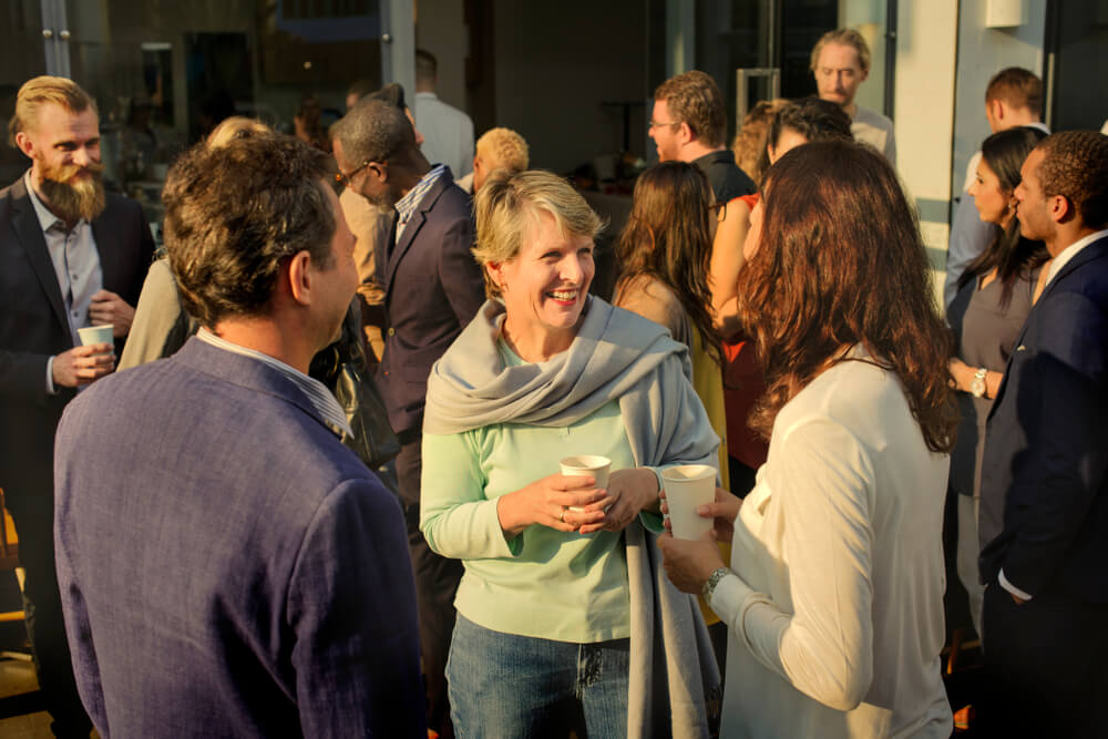 A group of people hanging out at an event.