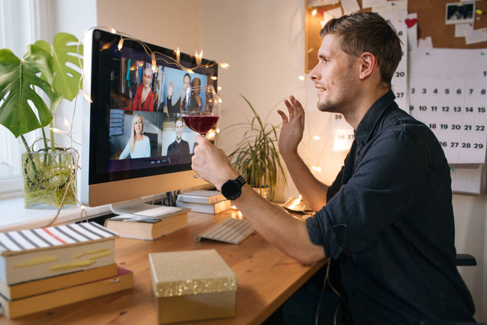 A man having a video conference event with co-workers.